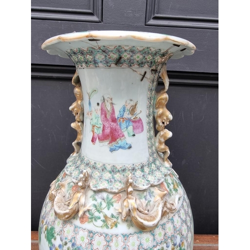 1425 - A large Chinese famille rose twin handled vase, 19th century, 44.5cm high, (riveted). ... 