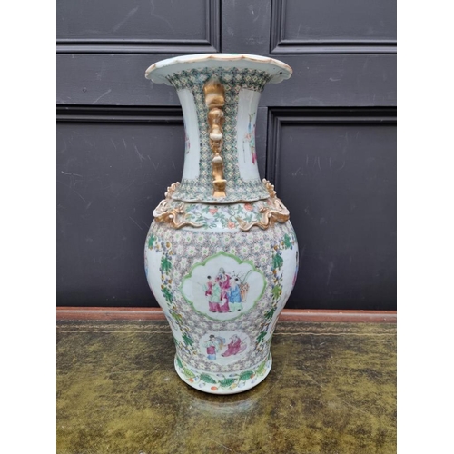 1425 - A large Chinese famille rose twin handled vase, 19th century, 44.5cm high, (riveted). ... 