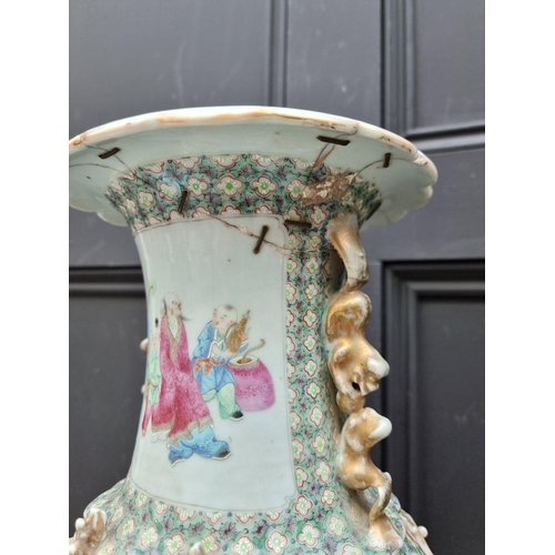 1425 - A large Chinese famille rose twin handled vase, 19th century, 44.5cm high, (riveted). ... 