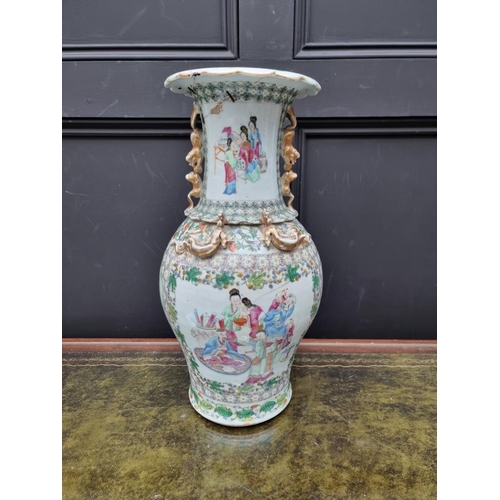 1425 - A large Chinese famille rose twin handled vase, 19th century, 44.5cm high, (riveted). ... 