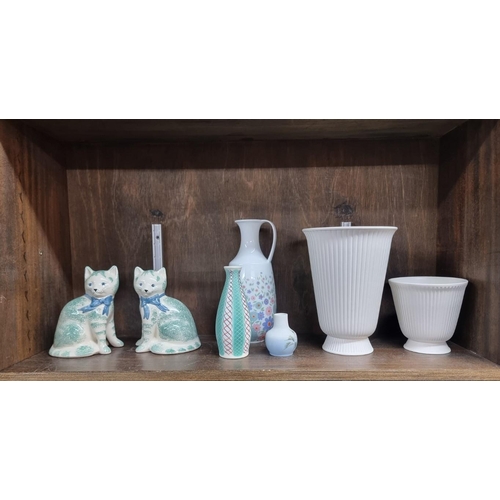 1426 - A mixed group of pottery and porcelain, comprising: two Wedgwood white glazed vases, largest 20.5cm ... 