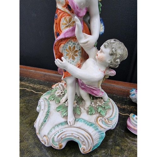 1434 - An 18th century Bow porcelain figure of Mars, 30cm high; together with a pair of Derby figural candl... 