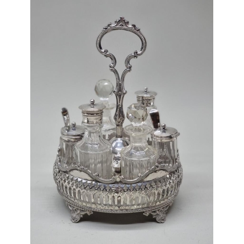 1471 - An antique electroplated cruet stand, with six original bottles, 26cm high.