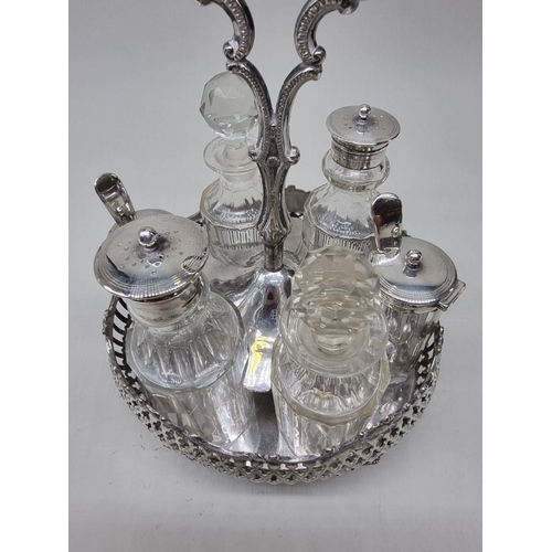 1471 - An antique electroplated cruet stand, with six original bottles, 26cm high.