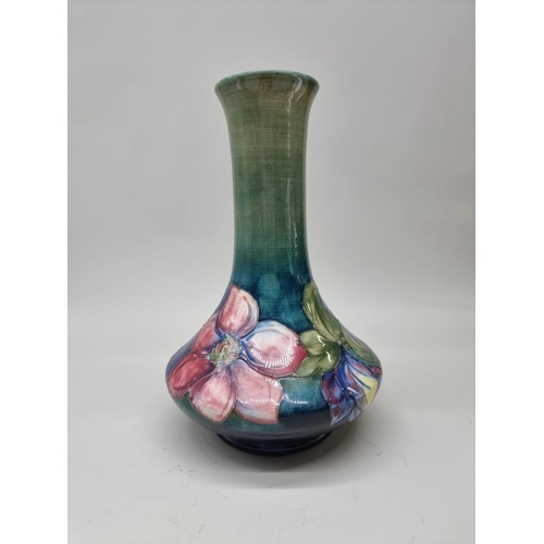 1477 - A Walter Moorcroft 'Clematis' pattern baluster vase, 30.5cm high.