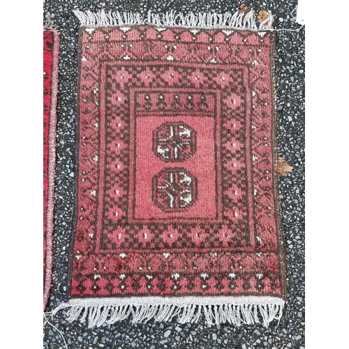 1131 - Four various prayer mats, all on a red ground, largest, 66 x 74cm. 