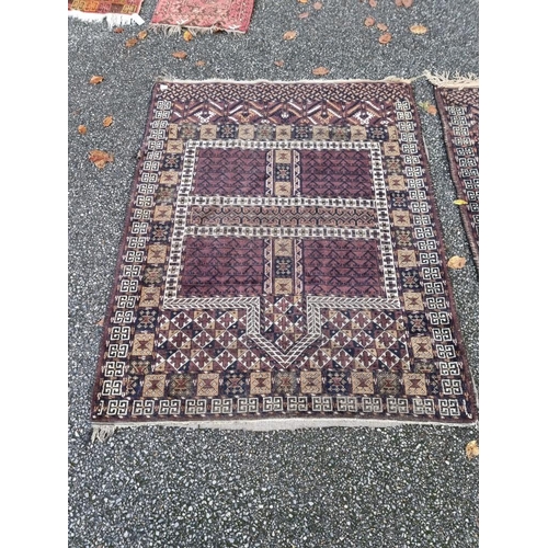 1132 - A pair of Persian rugs, having temple design to central fields, with geometric decoration, 150 x 120... 