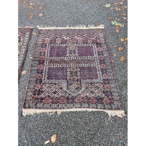 1132 - A pair of Persian rugs, having temple design to central fields, with geometric decoration, 150 x 120... 