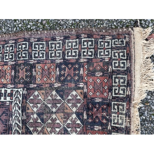 1132 - A pair of Persian rugs, having temple design to central fields, with geometric decoration, 150 x 120... 