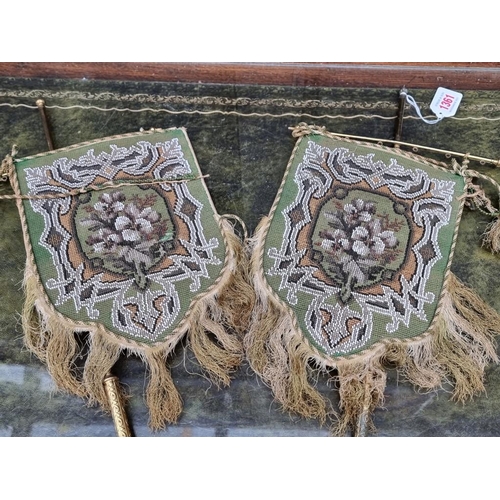 1361 - An unusual pair of Victorian beadwork panels or screens, with fringed edges, on brass mounts, total ... 