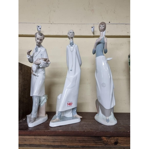 1407 - Three Lladro figures, comprising: 'Veterinarian'; 'Doctor'; and 'Girl with Letter'; largest 40cm hig... 