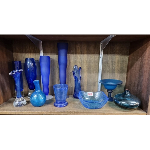 1419 - A group of blue glass vases and similar, largest 32.5cm high. (11) 