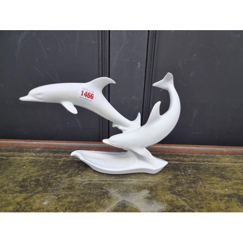 1466 - A Kaiser bisque porcelain figure group of dolphins, 29cm wide, boxed.