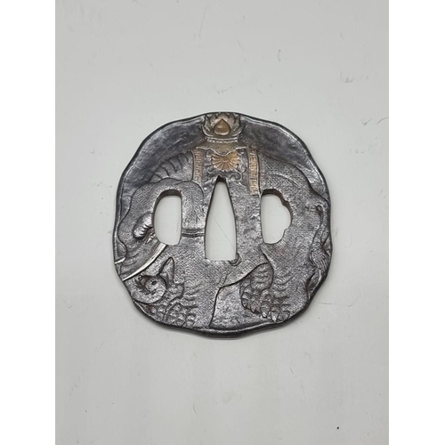 1601 - A Japanese steel tsuba, probably Edo, decorated to one side with an elephant, with silvered and gilt... 