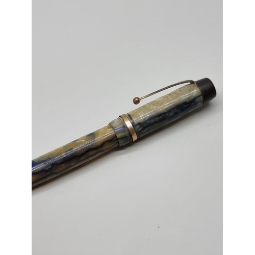 1603 - Four vintage pens, to include a Parker 'Slimfold', with 14k nib; and Mentmore 'Diploma', with 14ct n... 