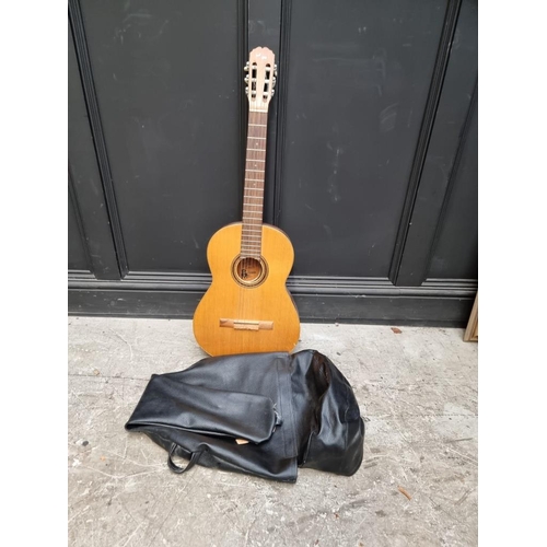 1672 - A BM acoustic guitar, in bag.