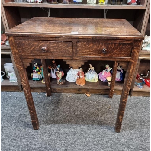 1063 - An Art Deco oak two drawer side table, 64cm wide.