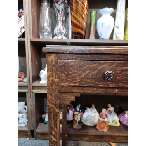 1063 - An Art Deco oak two drawer side table, 64cm wide.