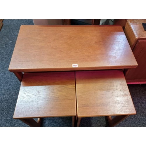 1100 - A mid-century nest of three Mackintosh teak tables, the largest with fold-over top, 76.5cm wide.... 