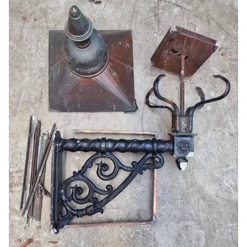 1673 - A Victorian style black painted cast metal wall bracket and coppered lantern, the lantern 35cm wide,... 