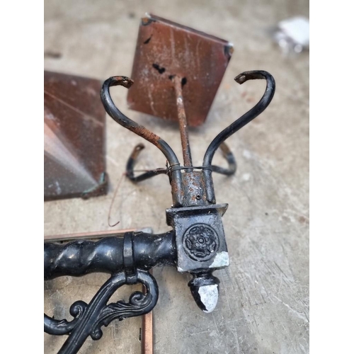 1673 - A Victorian style black painted cast metal wall bracket and coppered lantern, the lantern 35cm wide,... 