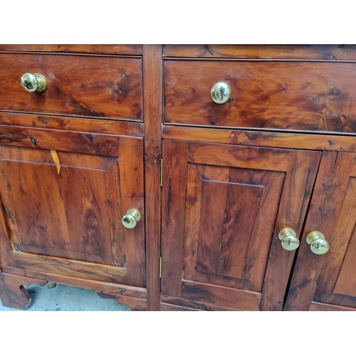 1100A - A solid yew dresser and rack, by Stephen Clear, 197cm wide.