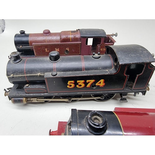 111 - Bassett-Lowke: a vintage 0 gauge locomotive No.5374; together with three similar locomotives by... 