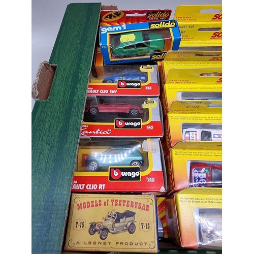 148 - Solido: a group of thirty-six 1/43 scale vehicles, all boxed; together with a few other example... 