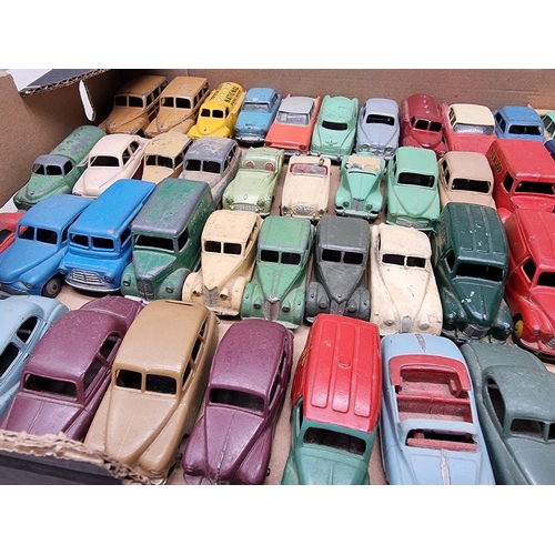 150 - Vintage Diecast: a large group of Dinky vehicles, to include trucks and cars, playworn with som... 