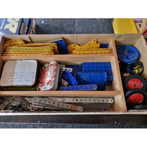 168 - Meccano: four storage boxes of Meccano components, various ages and condition.