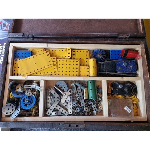 168 - Meccano: four storage boxes of Meccano components, various ages and condition.