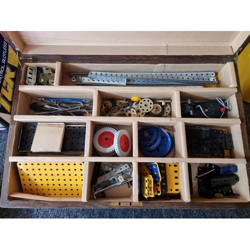 168 - Meccano: four storage boxes of Meccano components, various ages and condition.