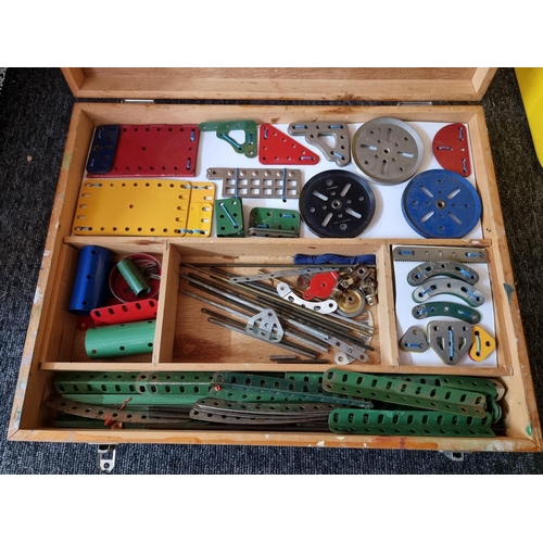 168 - Meccano: four storage boxes of Meccano components, various ages and condition.