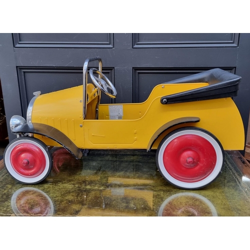 182 - A modern child's pressed steel pedal car, 96cm long, 20cm height to seat.... 