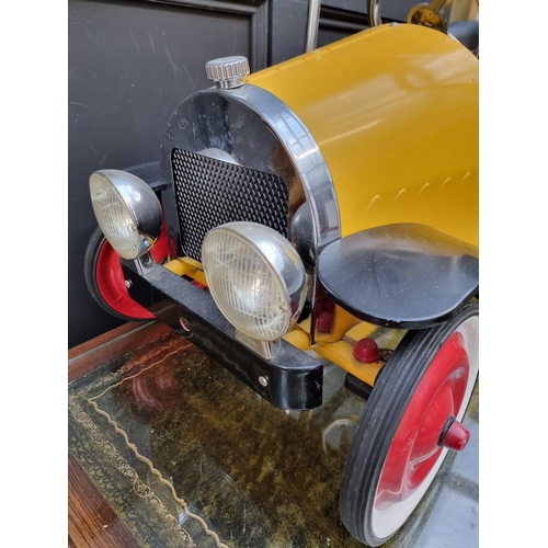 182 - A modern child's pressed steel pedal car, 96cm long, 20cm height to seat.... 