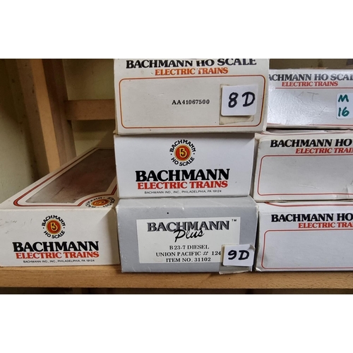 62 - Bachmann: a group of boxed locomotives and freight trucks, to include Union Pacific and Santa F... 