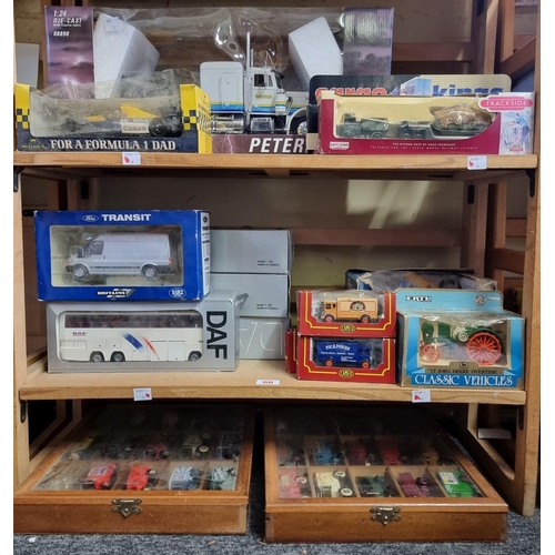 66 - Diecast: a group of various scale boxed diecast vehicles, to include Ertl; together with two sm... 