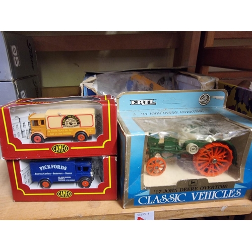 66 - Diecast: a group of various scale boxed diecast vehicles, to include Ertl; together with two sm... 