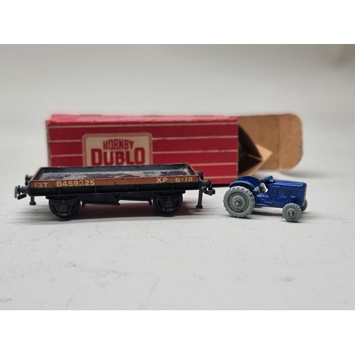 72 - Hornby Dublo: a collection of vintage (red box) goods wagons and tankers, to include United Dai... 