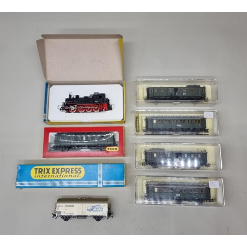 81 - Trix: a small group comprising: a locomotive and coaches, all boxed. (8)