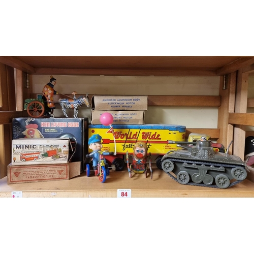 84 - Vintage Tinplate: a collection, to include two boxed Triang Minic vehicles; together with a Louis Ma... 