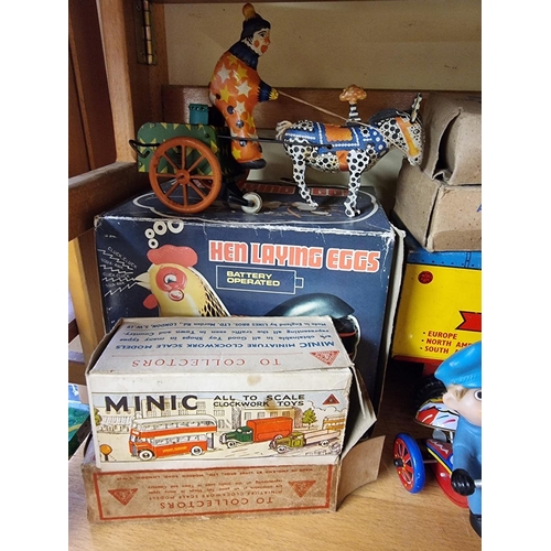 84 - Vintage Tinplate: a collection, to include two boxed Triang Minic vehicles; together with a Louis Ma... 