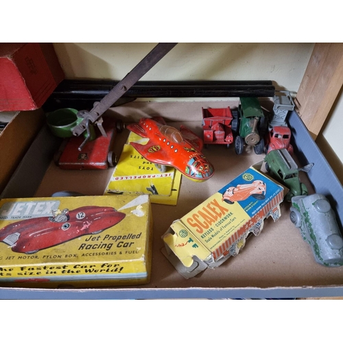 92 - Jetex: a vintage boxed jet propelled racing car, with accessories; a self-steering electric car... 