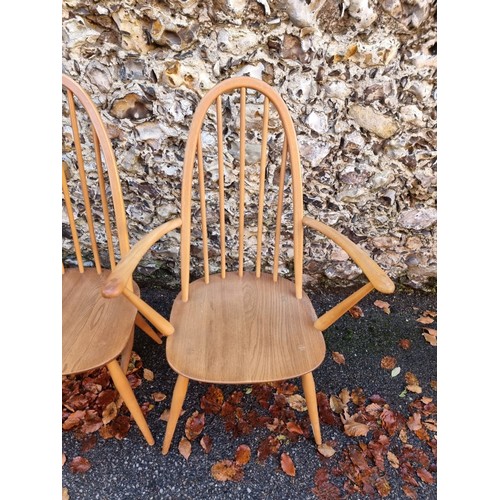 1010 - A set of six vintage Ercol 'Quaker' dining chairs, to include a pair of elbow chairs.... 