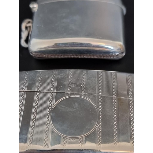 91 - A silver card case, Birmingham 1914; together with a silver vesta case, Birmingham 1945, total weigh... 