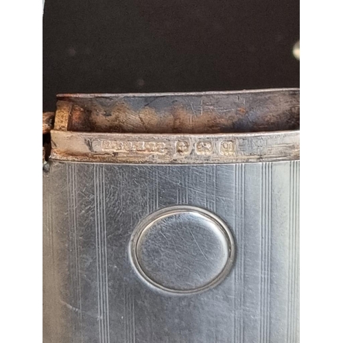 94 - A silver card case, Birmingham 1938; together with a silver vesta case, Birmingham 1915, total weigh... 