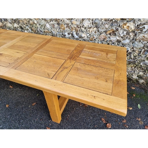1015 - A contemporary pale oak drawleaf dining table, with two small extensions, 280cm extended.... 