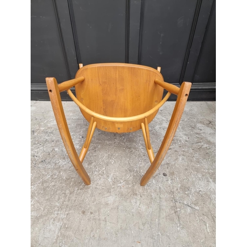 1080 - An Ercol swan back rocking chair. 