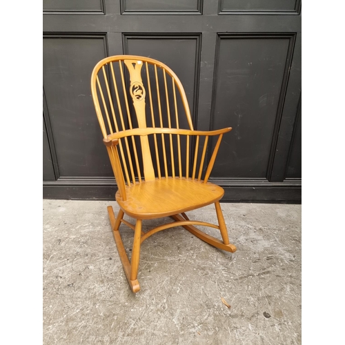 1080 - An Ercol swan back rocking chair. 