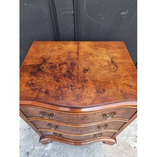1011 - A small reproduction burr walnut serpentine fronted chest, 53cm wide.